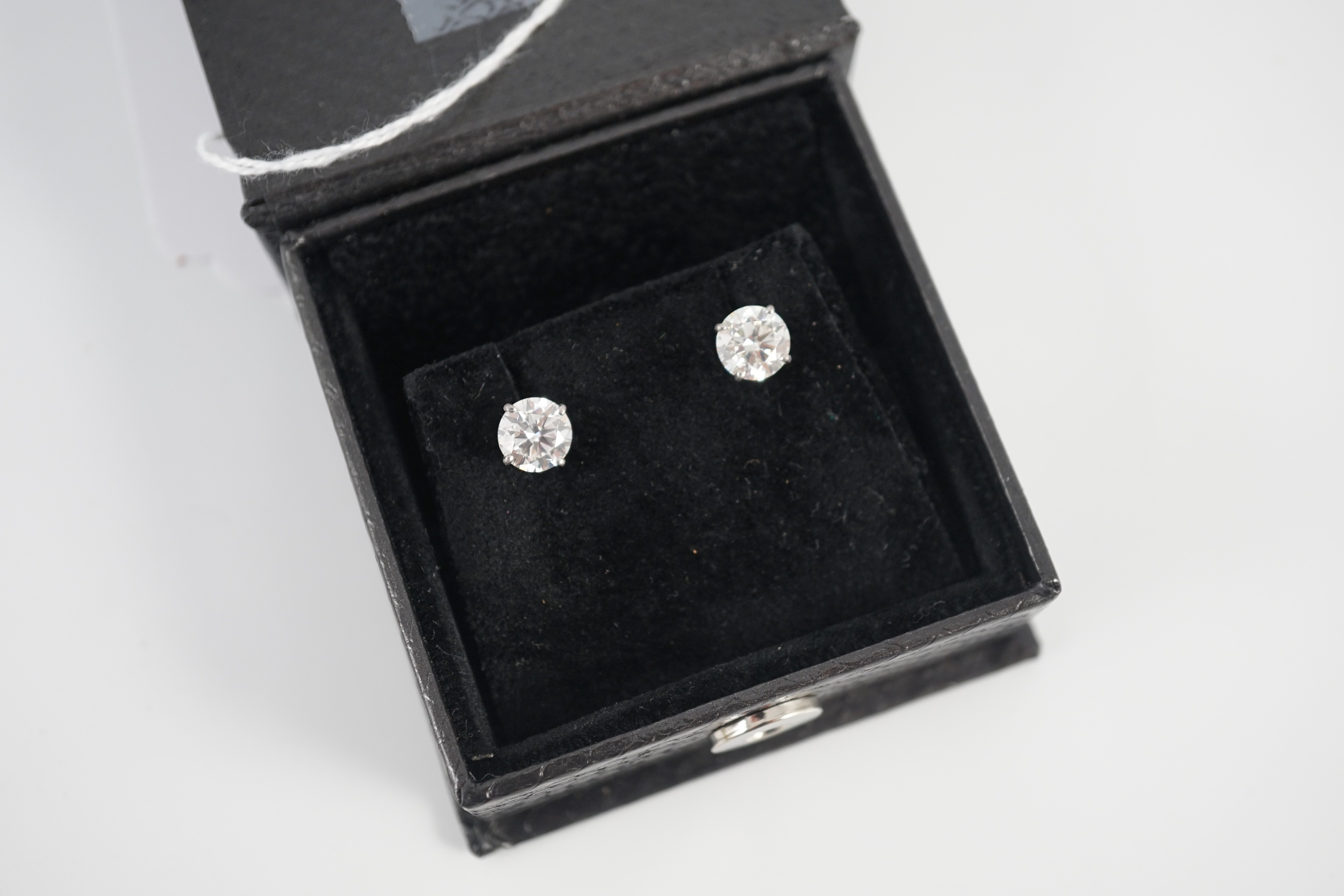 A pair of 750 white metal and solitaire diamond set ear studs, each stone weighing approximately 1.50ct